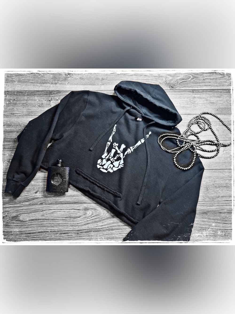 Cropped Black Hoodie with White Skeleton Hand Graphic